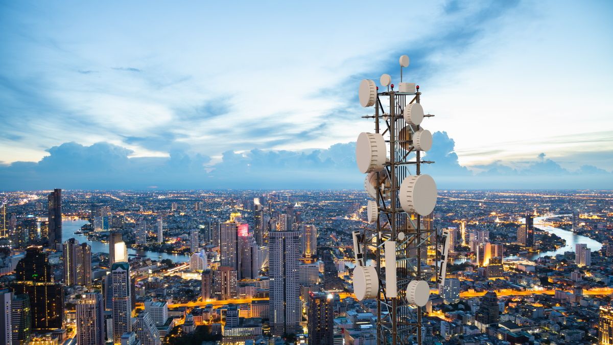 A 5G tower over a city.