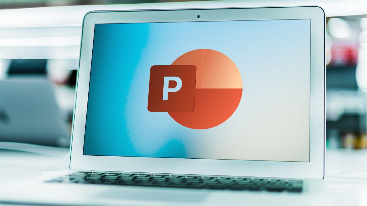 Microsoft PowerPoint logo on a laptop.