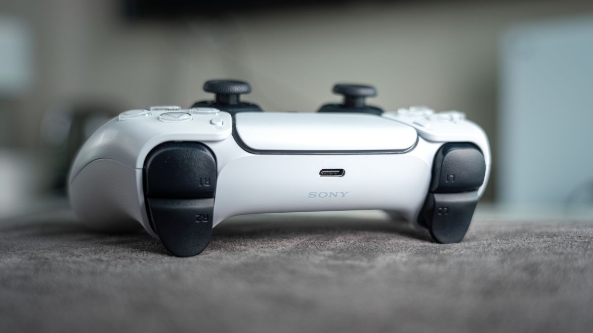 Closeup of the top of a white Dualsense controller for the Sony PlayStation 5.