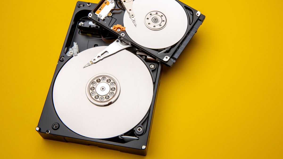 Mechanical hard drives with the covers removed and disks exposed.