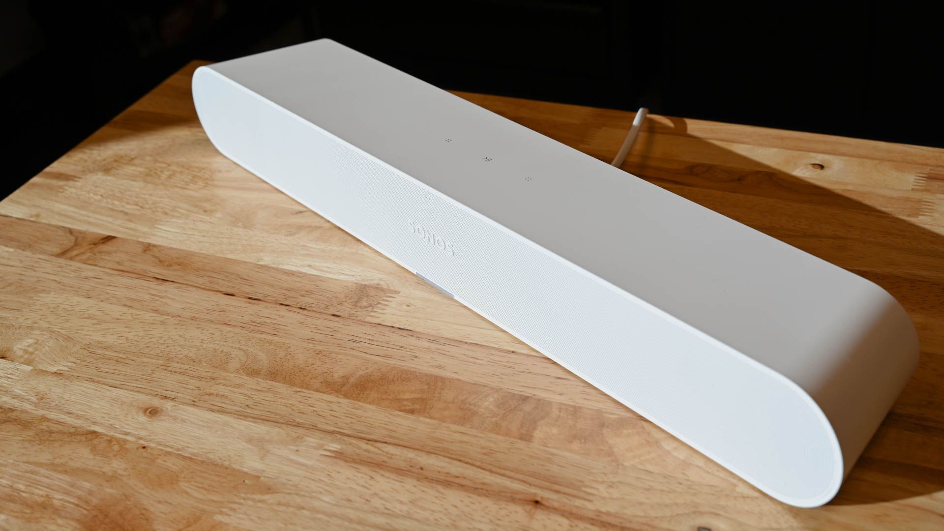 Sonos Ray soundbar angled on wooden counter