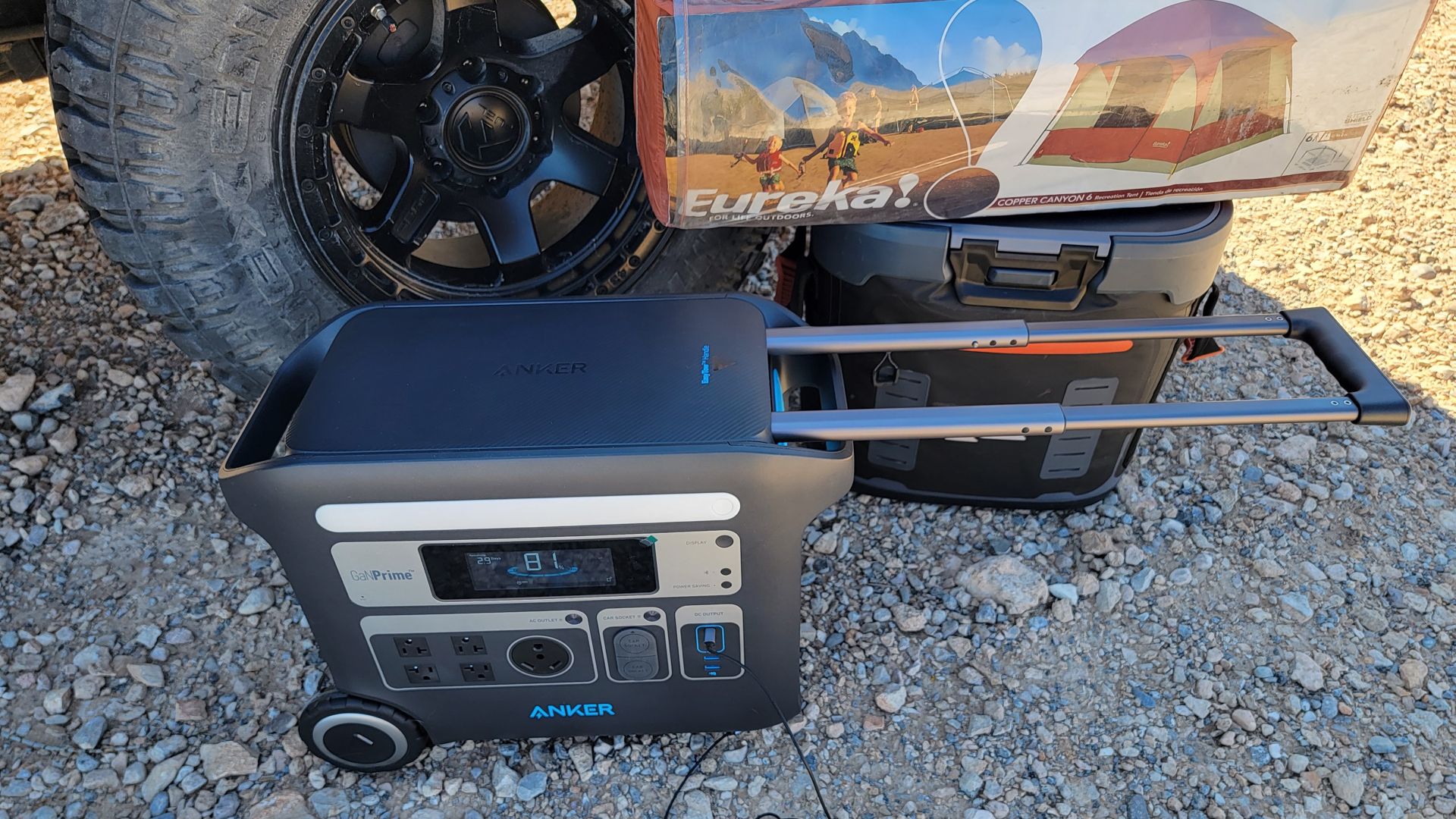 Anker 767 portable power station, tent, and a cooler.