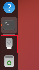 A USB memory stick icon in the GNOME dock, indicating a device has been connected to the a USB port on the computer, and mounted