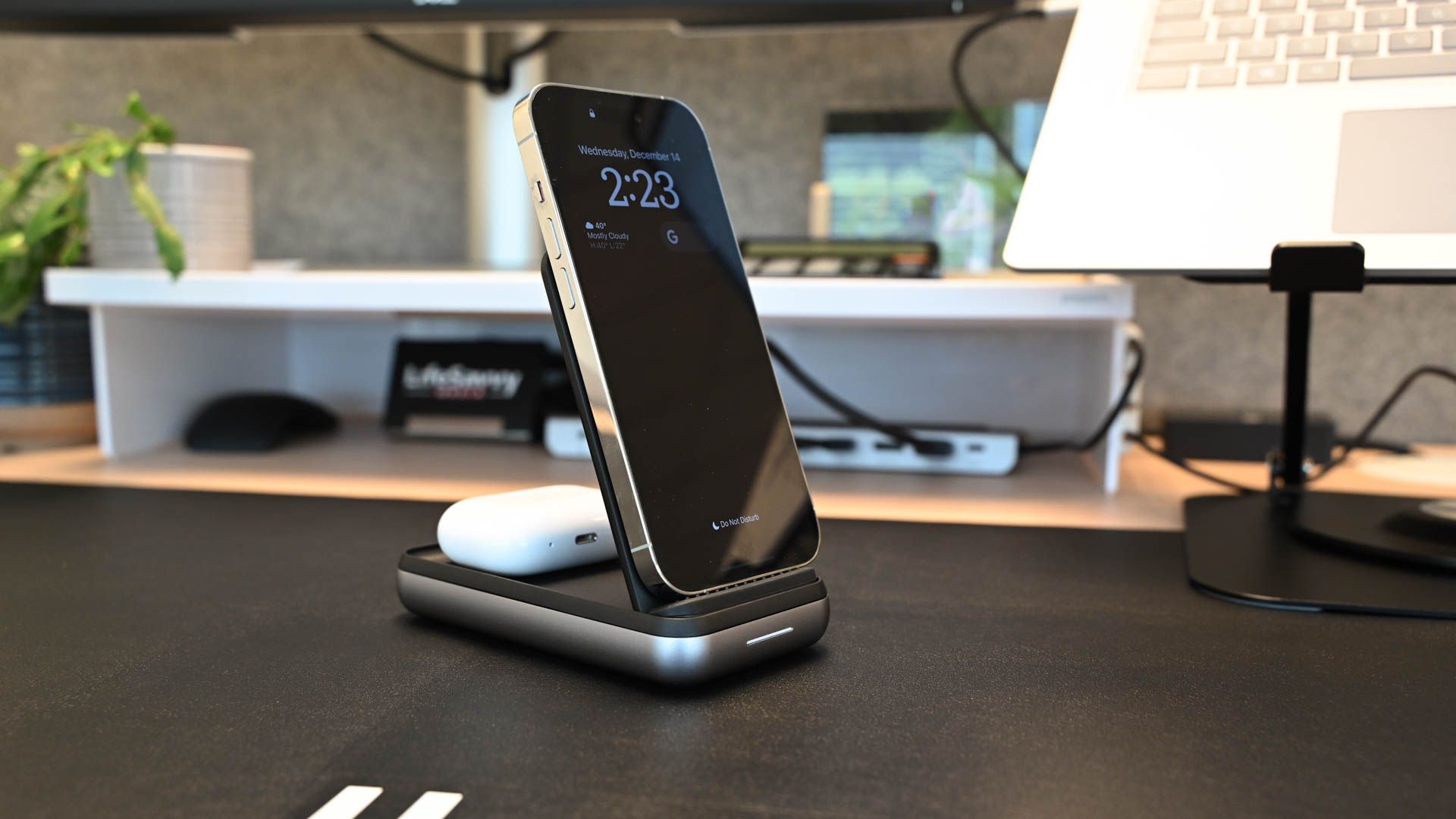 iPhone 14 and air pods charging on the Satechi Duo Wireless Charger Power Stand
