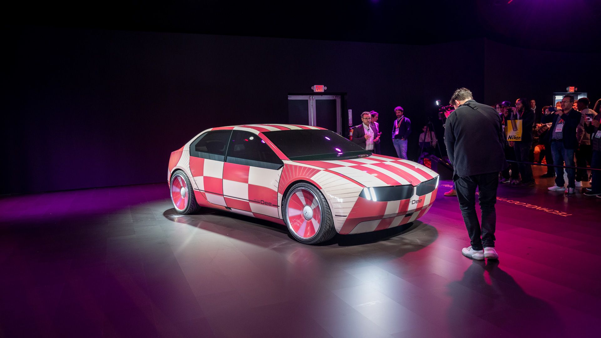 The BMW i Dee Vision with a pink and white checkerboard pattern at CES 2023.