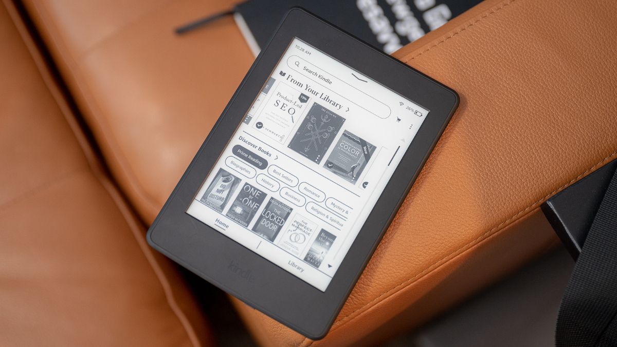 Kindle Paperwhite on couch.