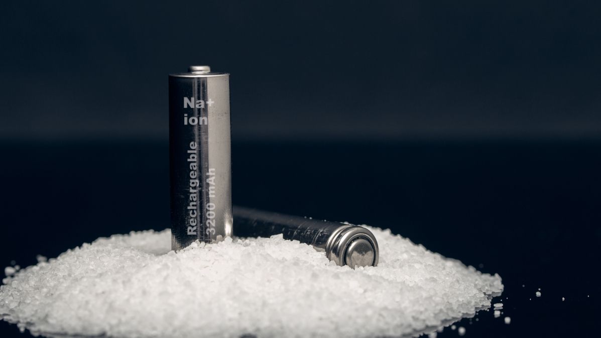 Two rechargeable sodium ion batteries on top of a pile of salt.