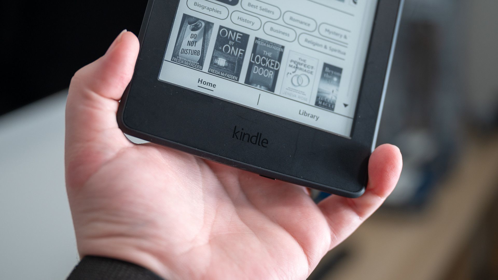 Kindle logo on the front of the 2015 Amazon Kindle Paperwhite eReader
