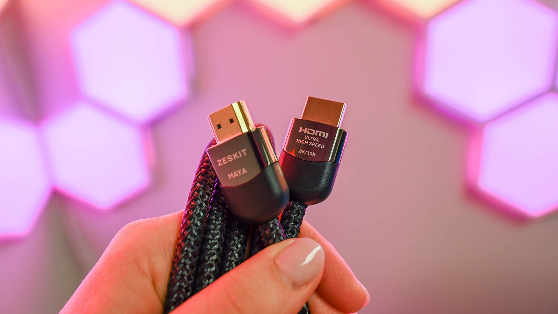 Person holding the Zeskit Maya 8K High-Speed HDMI Cable