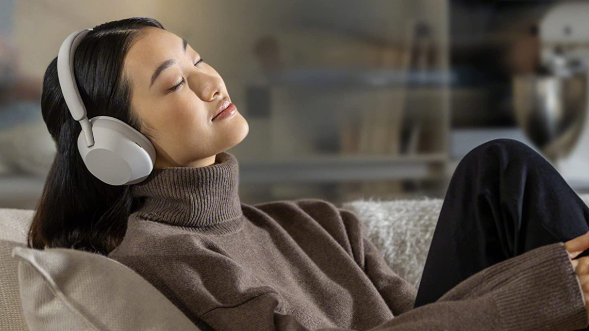 Girl listening to music on Sony WH-1000XM5 headphones