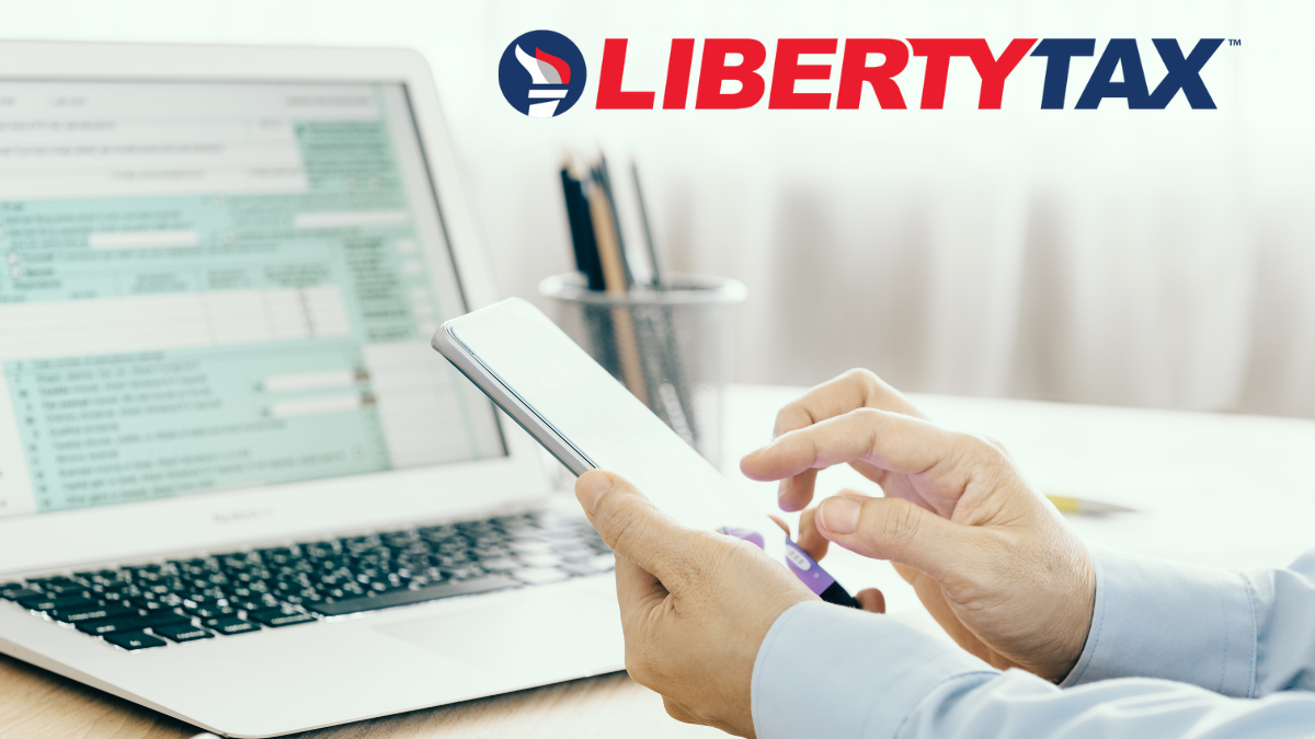 Liberty Tax - Person using cell phone and laptop