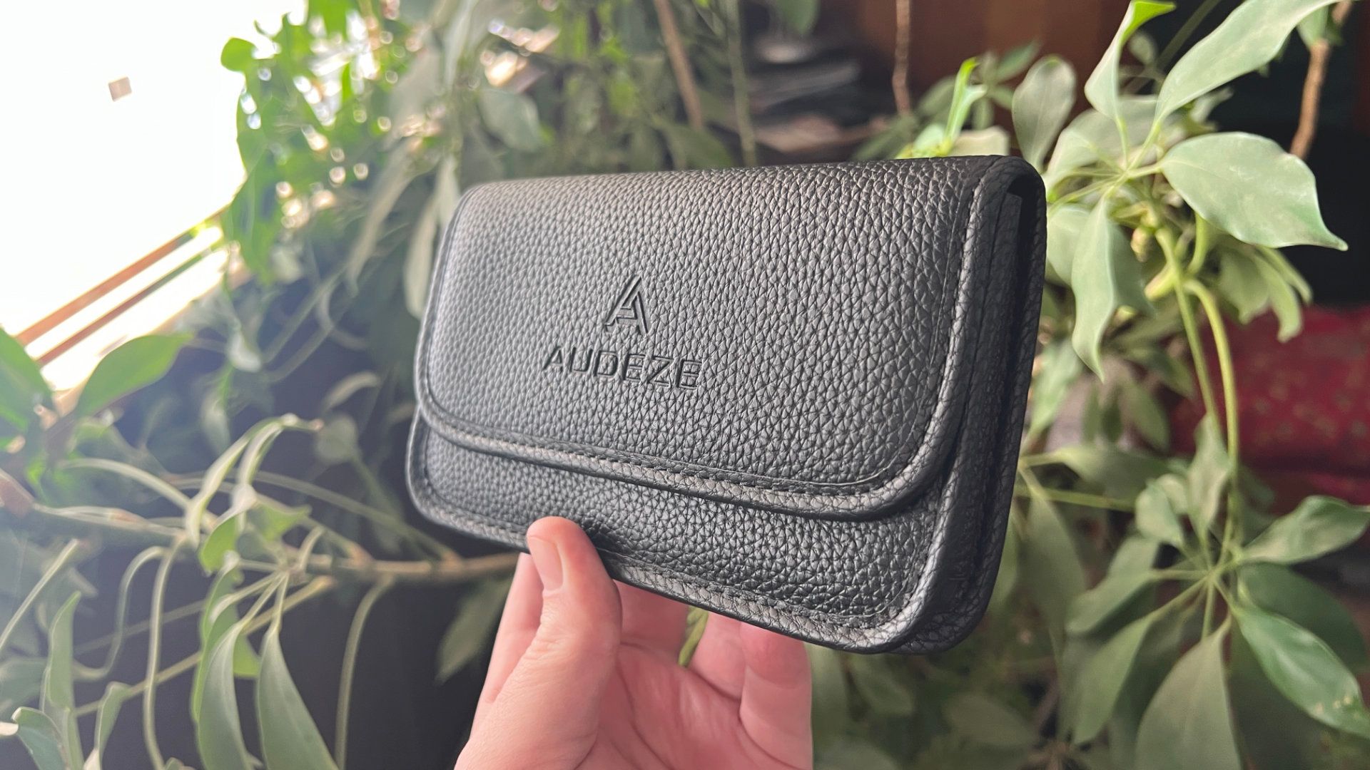 Person holding the Audeze Filter case