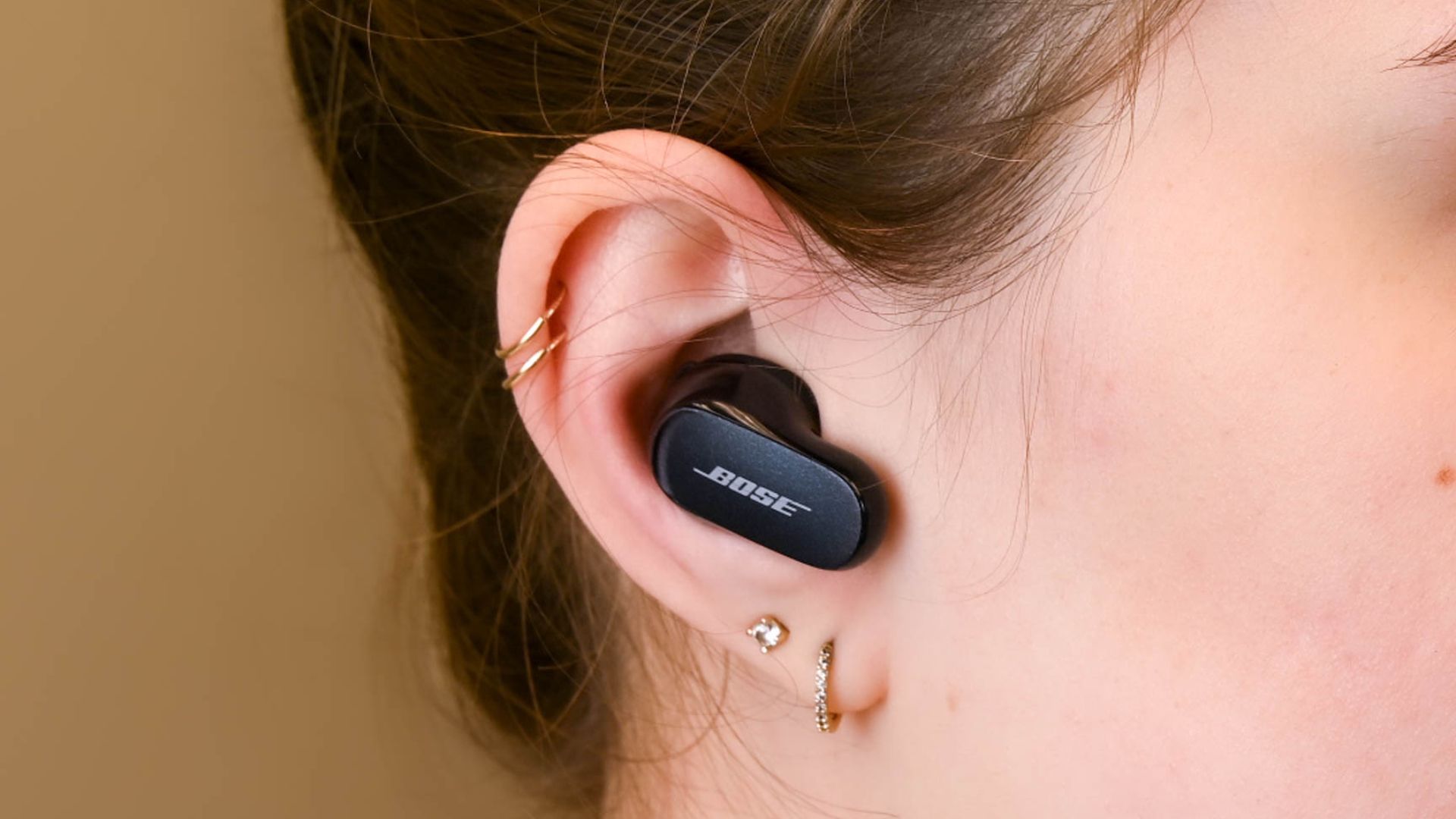 A person wearing the Bose QuietComfort Earbuds 2
