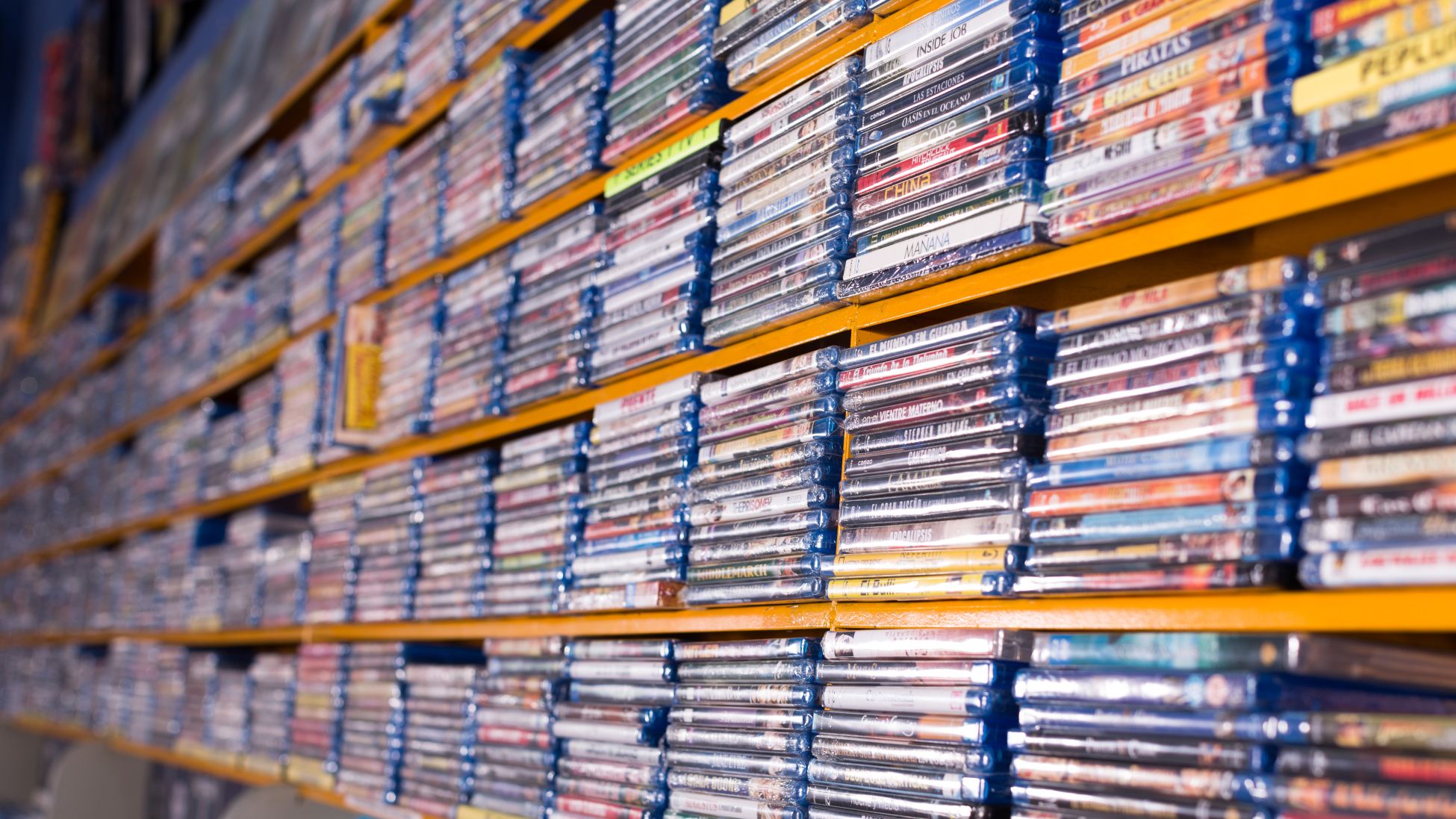 Large collection of movies on DVD for sale on display at a store