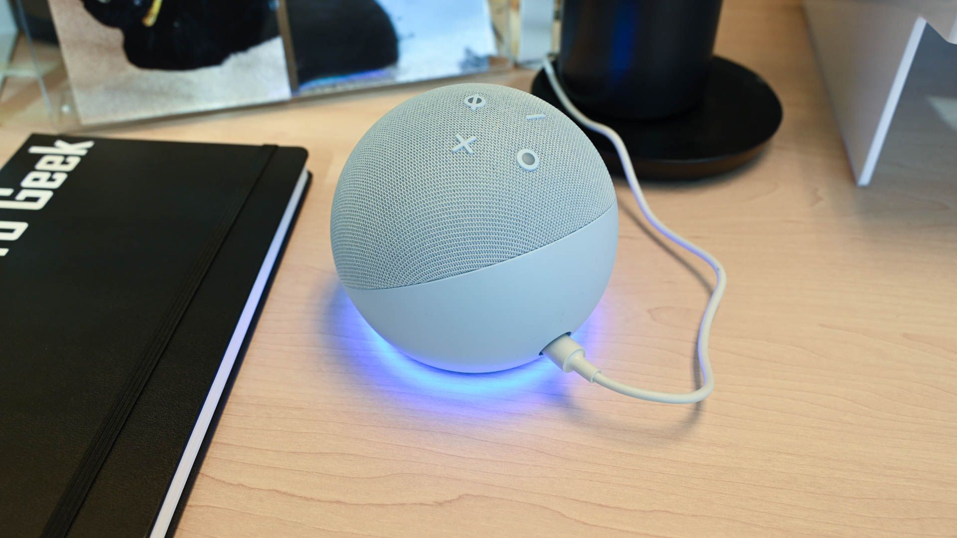 The back of the amazon echo dot 5th gen smart speaker on a desk