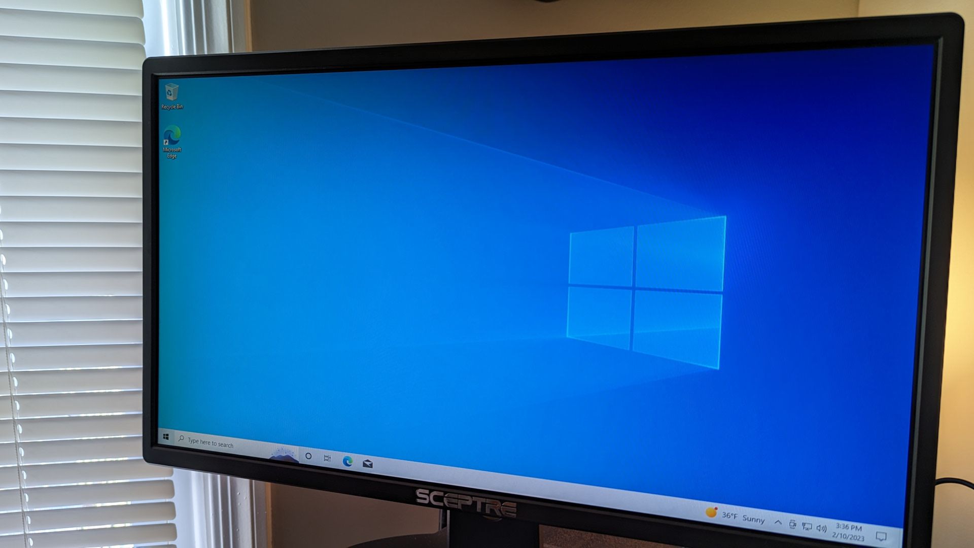 Computer monitor with the Windows 10 desktop on screen.