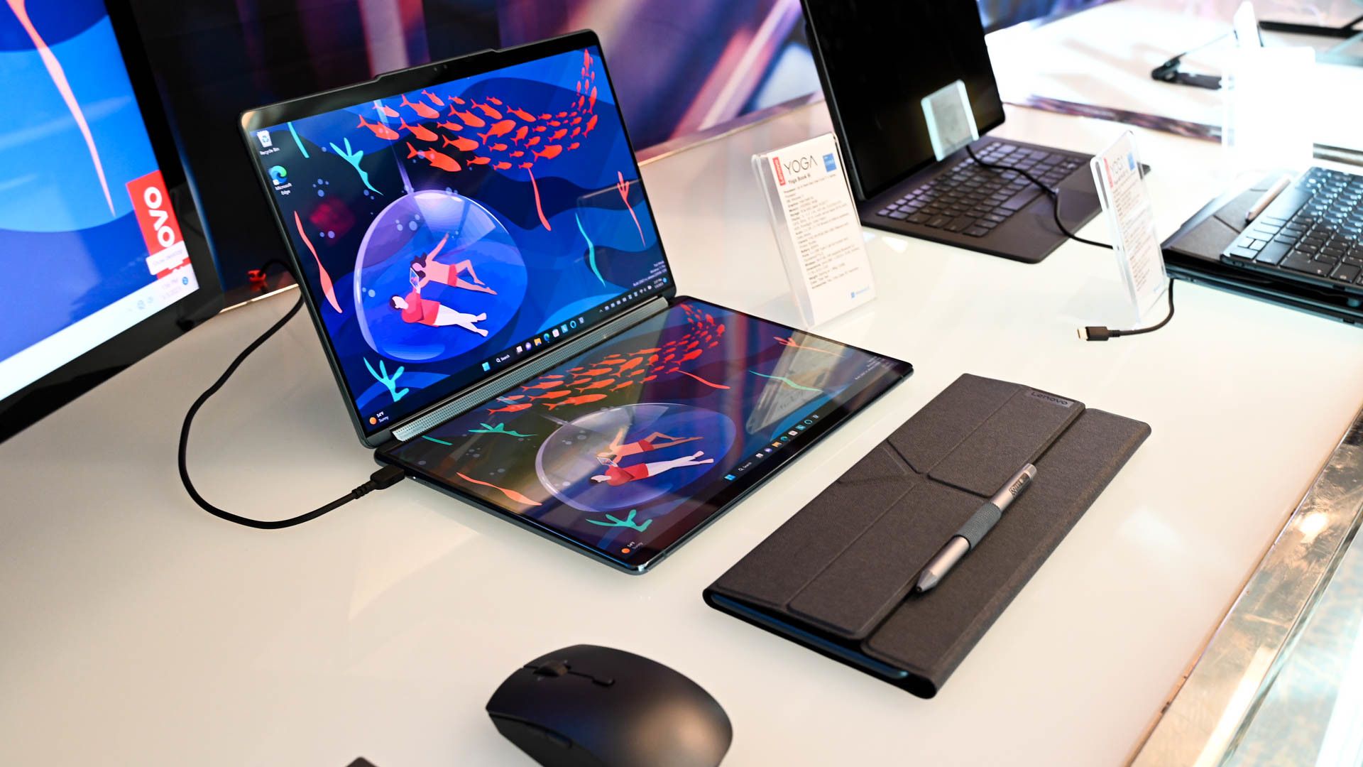 Lenovo Yoga 9i and stand on a desk.