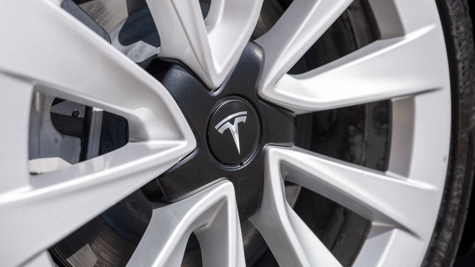 Tesla logo badge on a Tesla Model 3 wheel