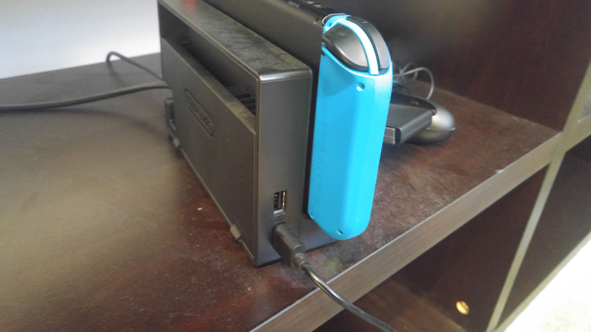 The left side of a Nintendo Switch dock, there the two USB-A ports are located.