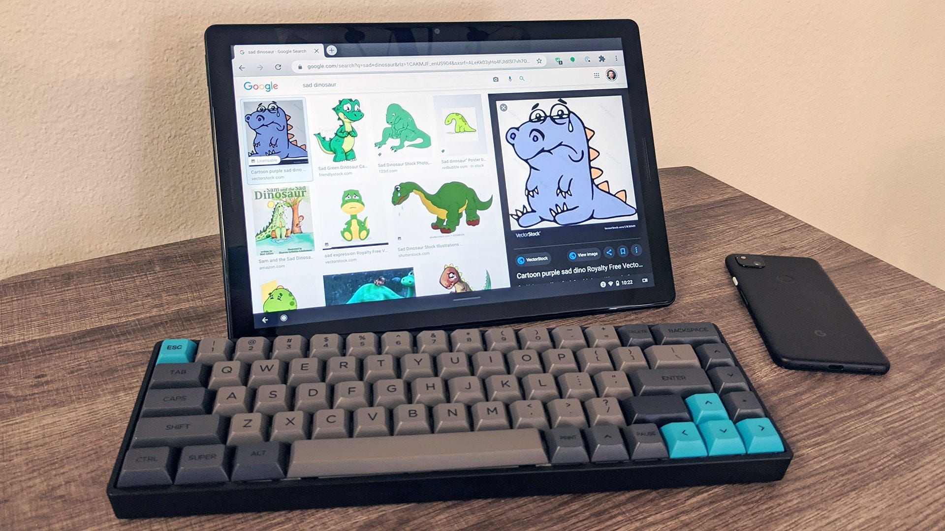 The Pixel Slate tablet with a Pixel smartphone and mechanical keyboard.