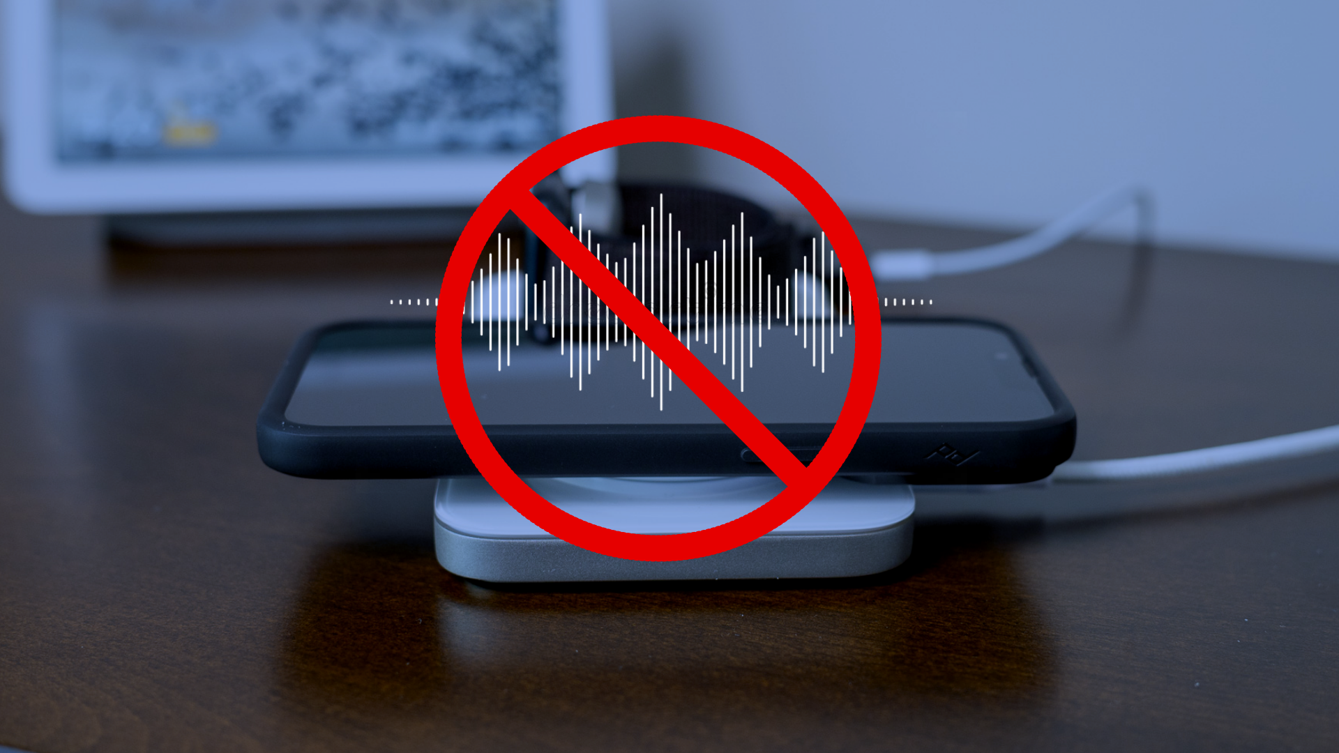 iPhone on charger with white noise crossed out.