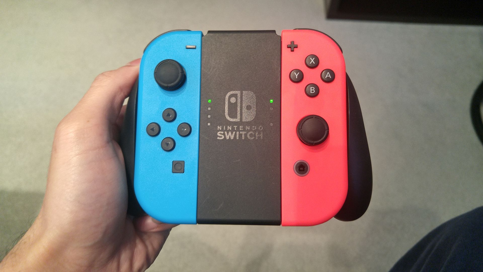 Two Joy-Cons inserted into a Joy-Con grip.