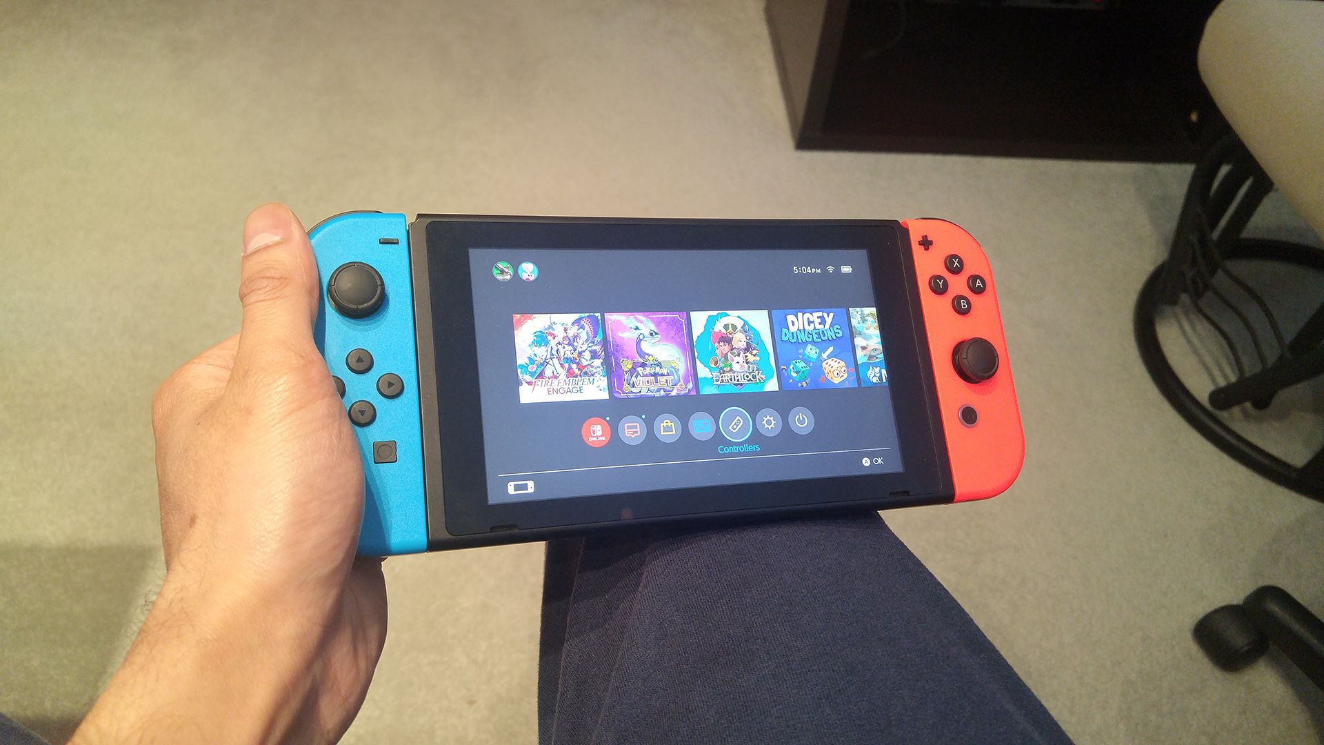 A Nintendo Switch with two Joy-Cons attached to it.