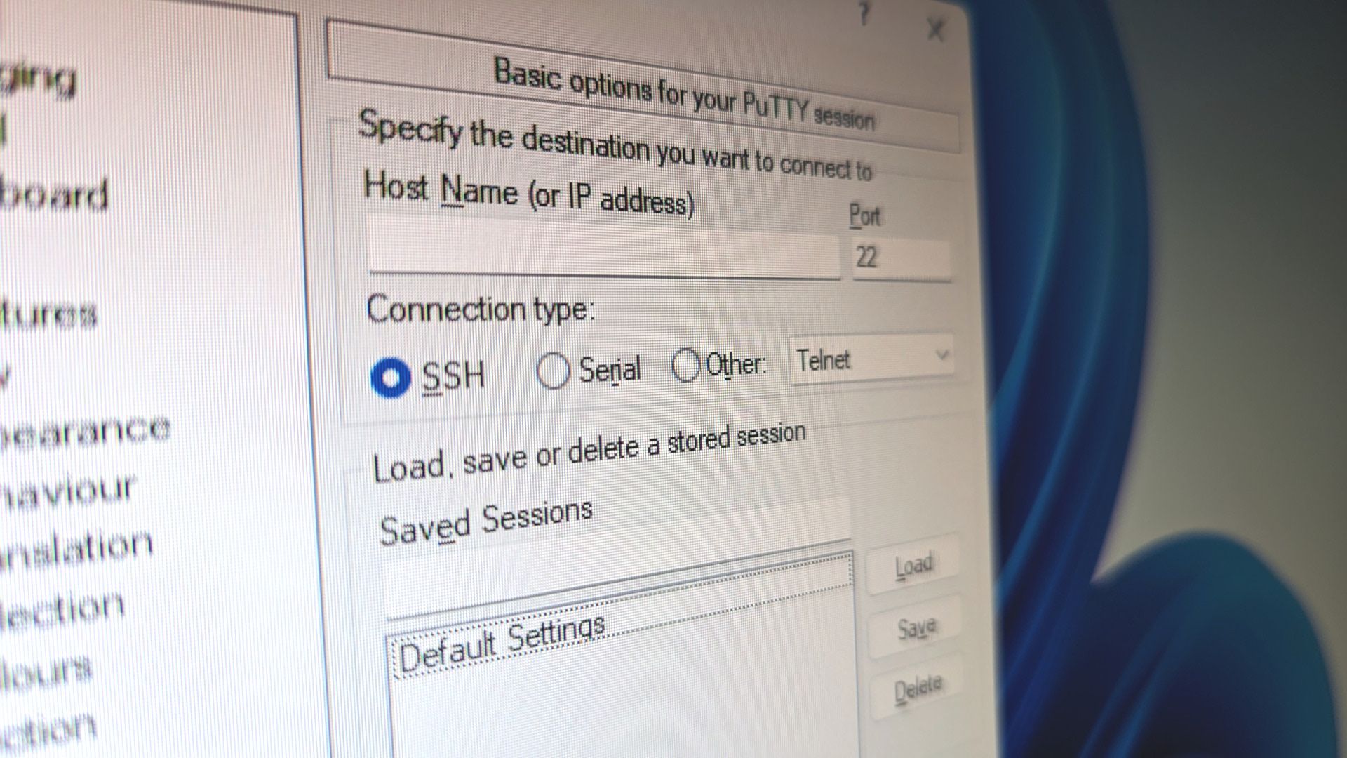 Closeup of a computer screen with PuTTY configuration options visible.