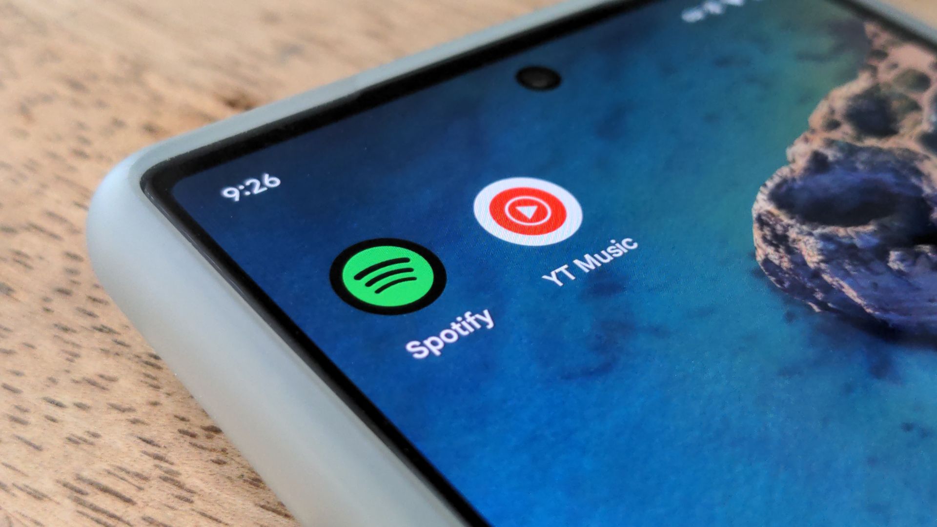 Closeup of Spotify and YouTube Music app icons on a Pixel 6 phone screen.