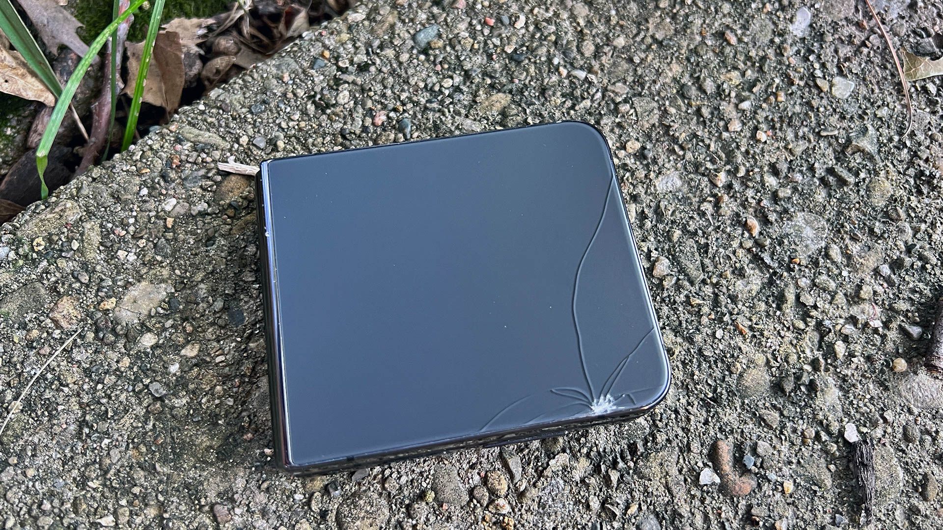 A broken back of a Galaxy Z Flip 4