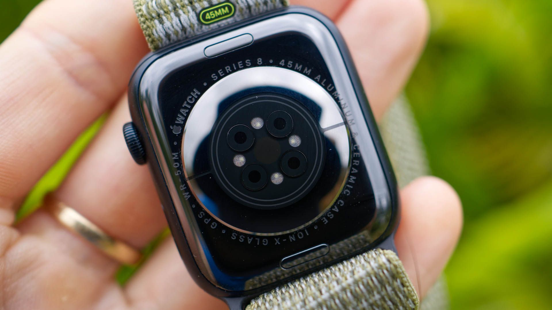 A close-up view of the optical sensors on the back of the Apple Watch Series 8