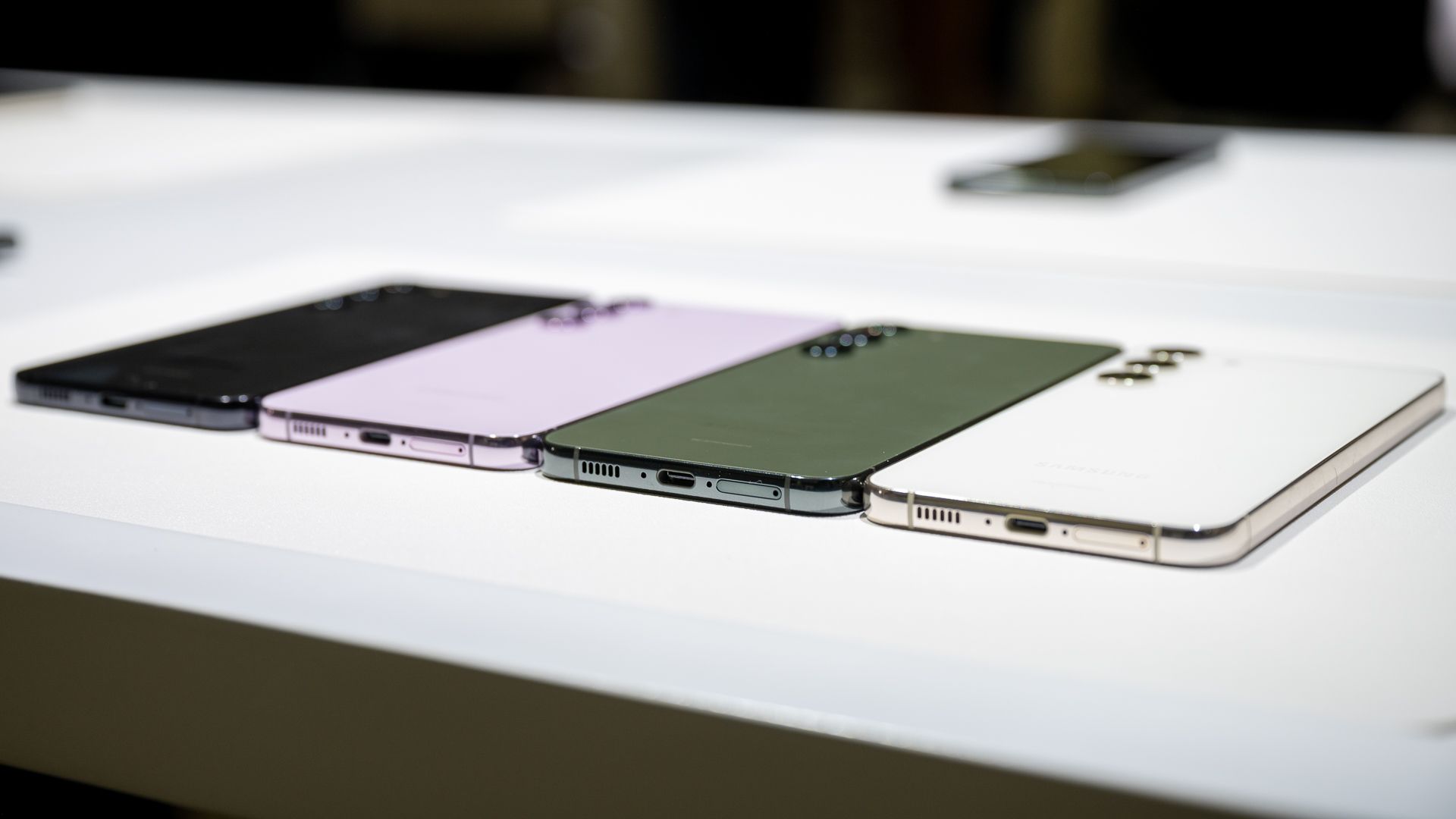 Phantom Black, Lavender, Green, and Cream Samsung Galaxy S23 Plus frames laying next to each other