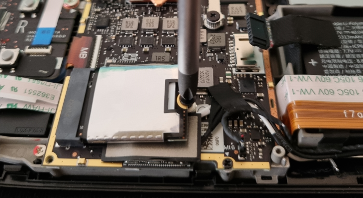 Install the new SSD and secure it with a screw