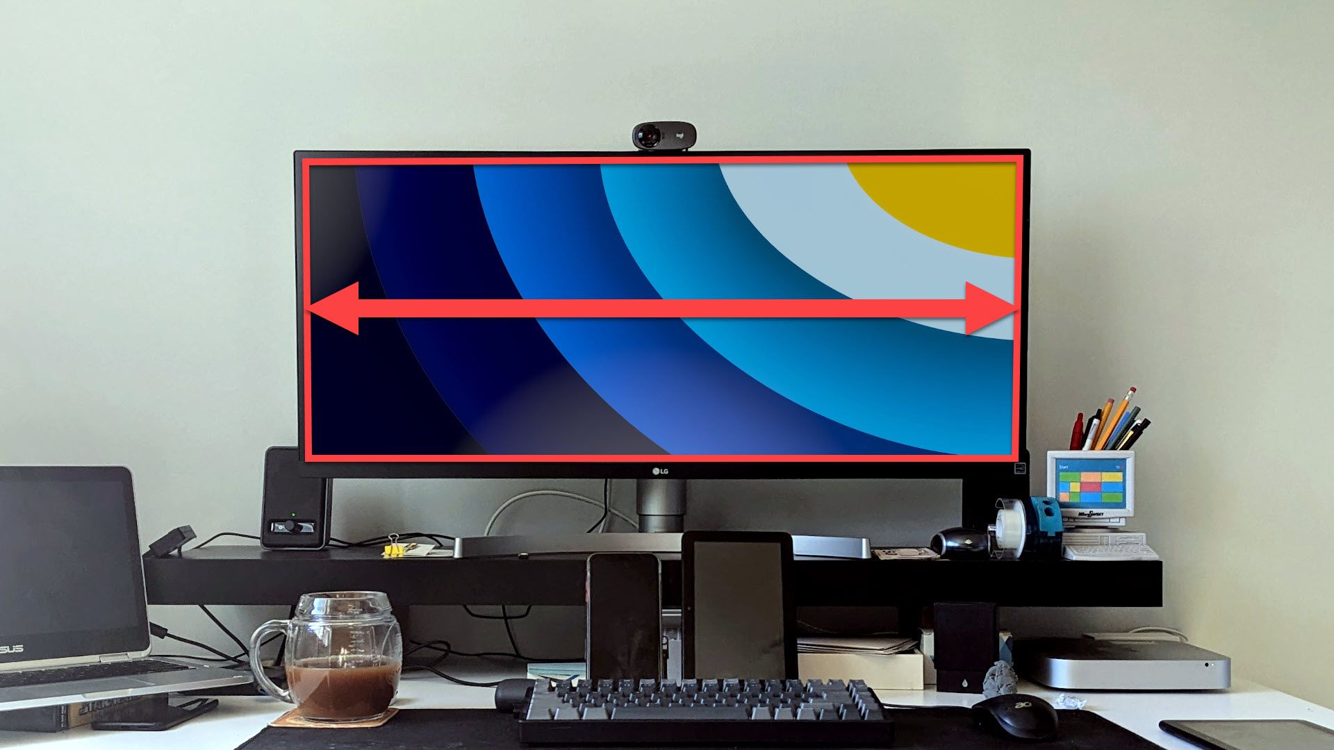 Ultrawide monitor on a desk.