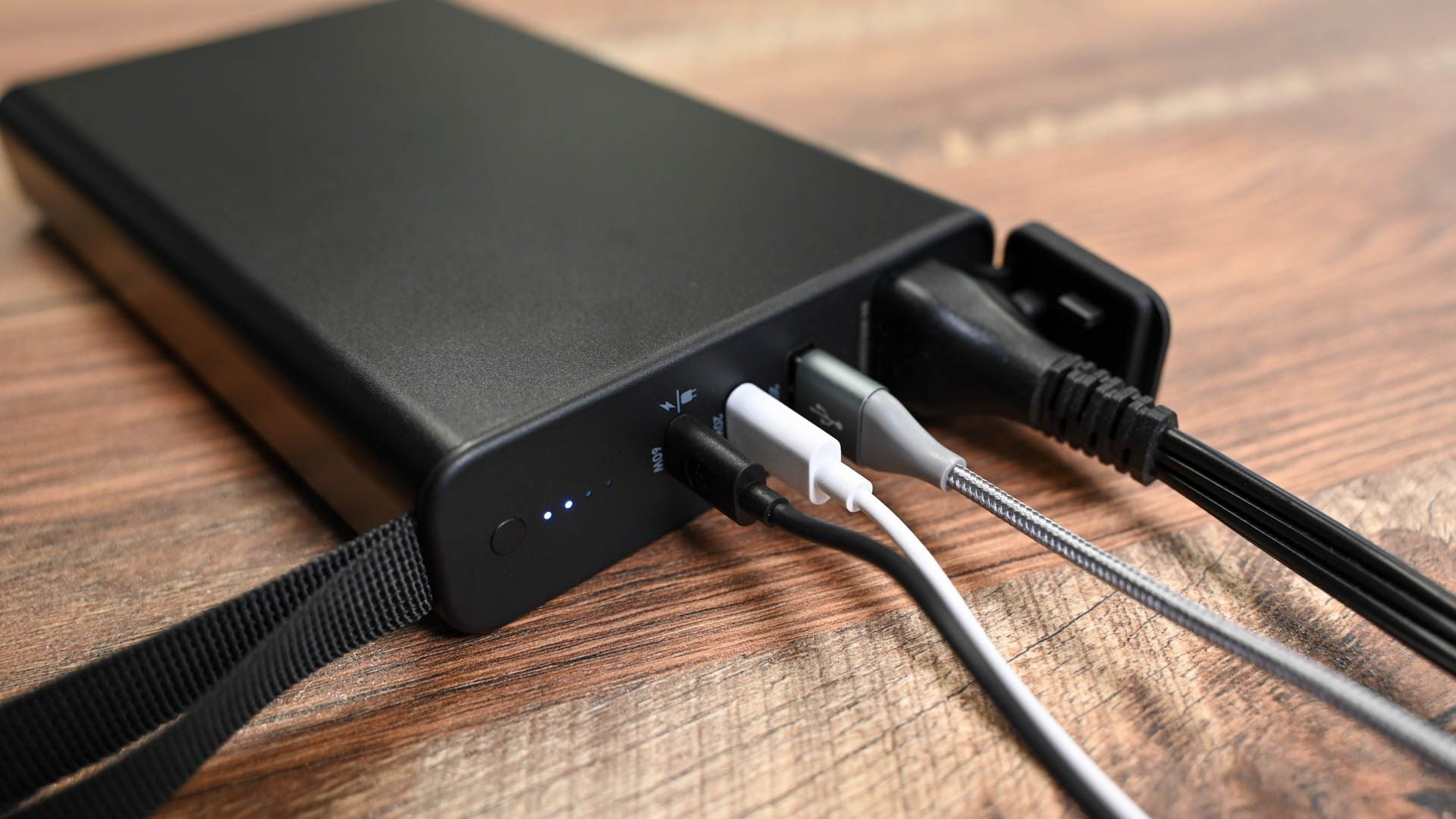 The mophie powerstation Pro AC with four cables connected.