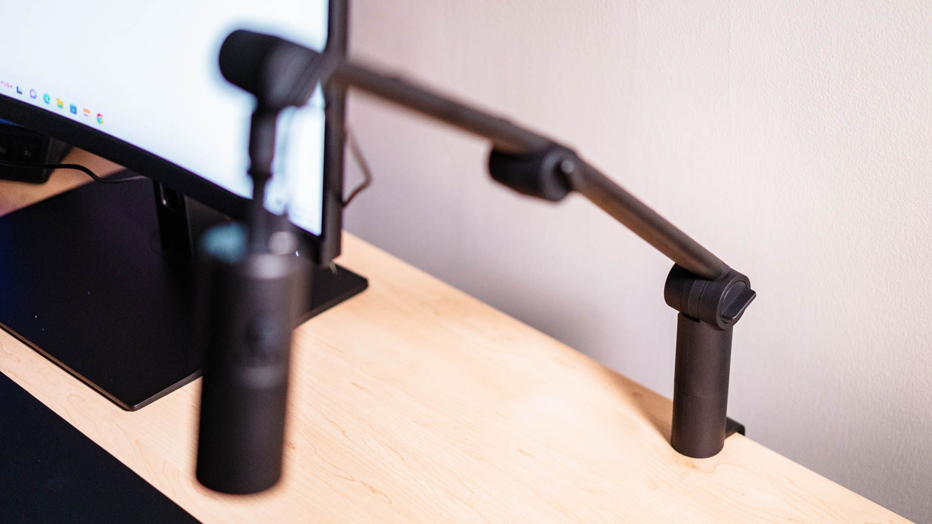 NZXT Capsule Mini Boom Arm clamp attached to a desk