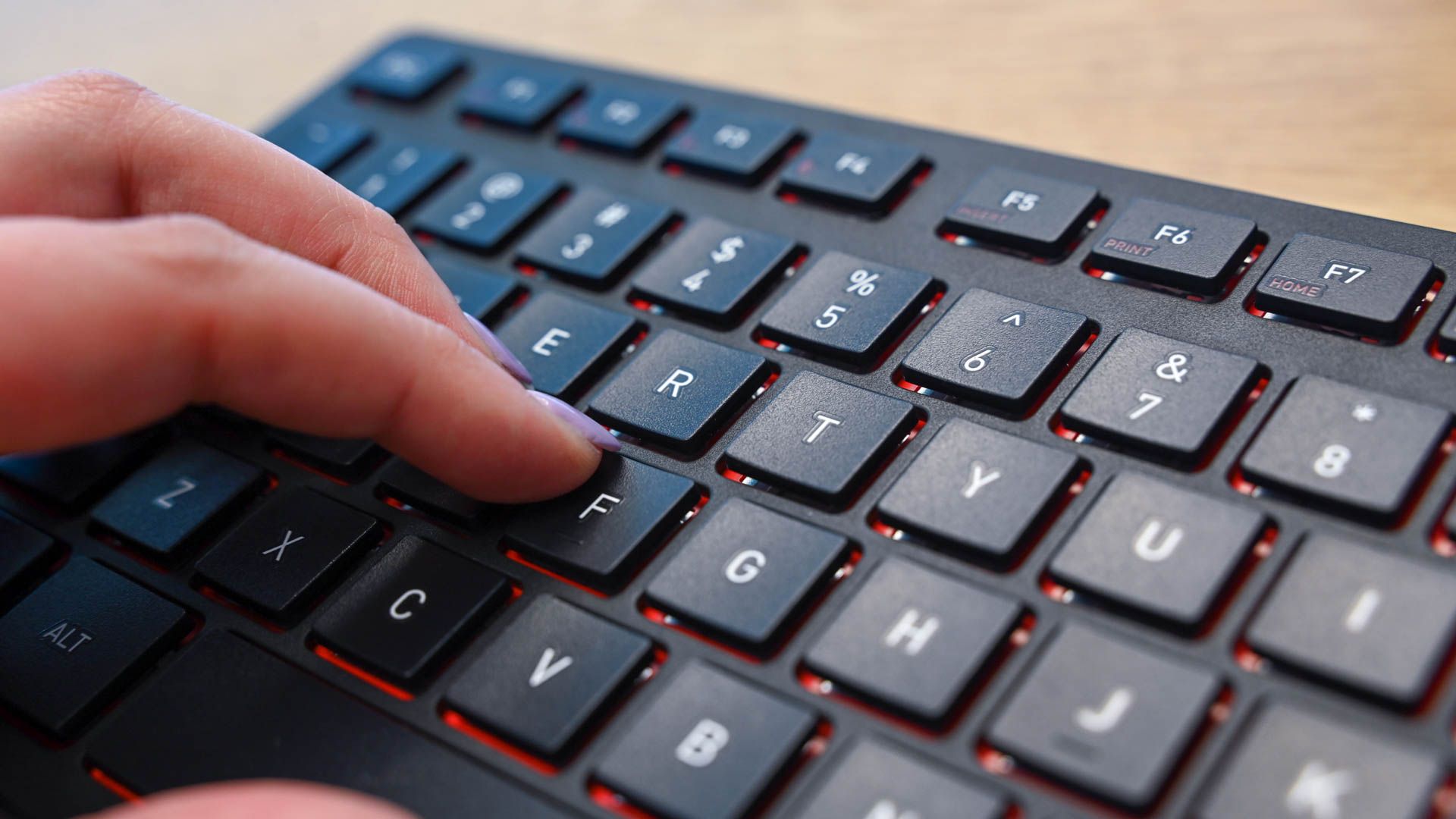 Person typing on the Cherry KW 9200 Mini Keyboard