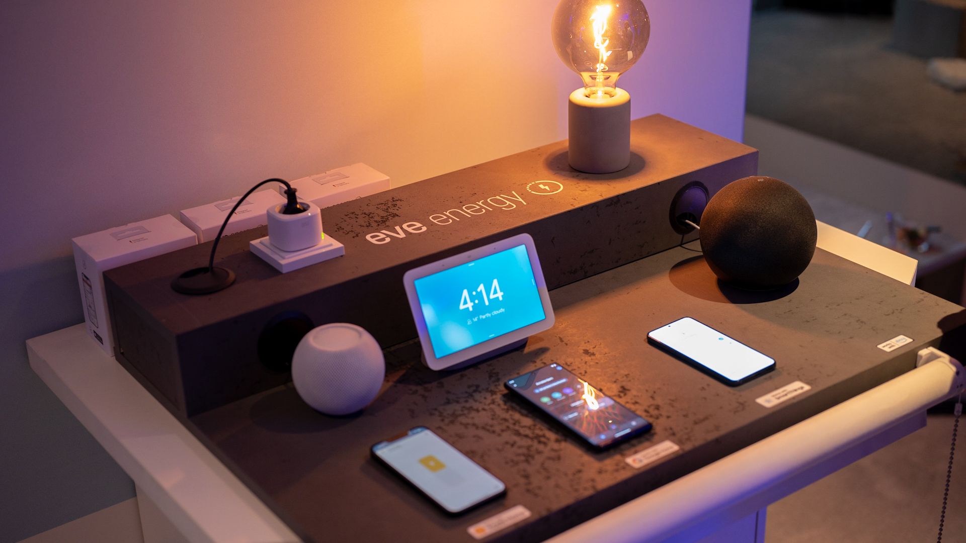 Eve energy smart plug being controlled over Matter by Apple HomePod Mini, Google Nest Hub, and Amazon Echo
