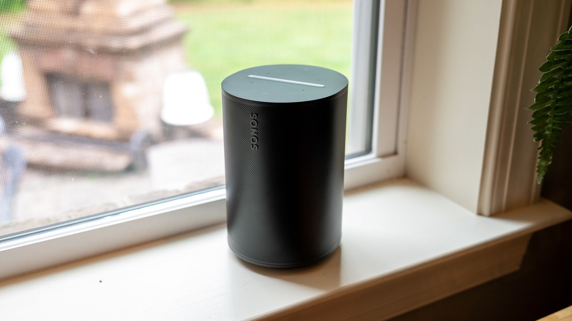 Sonos Era 100 sitting on a shelf