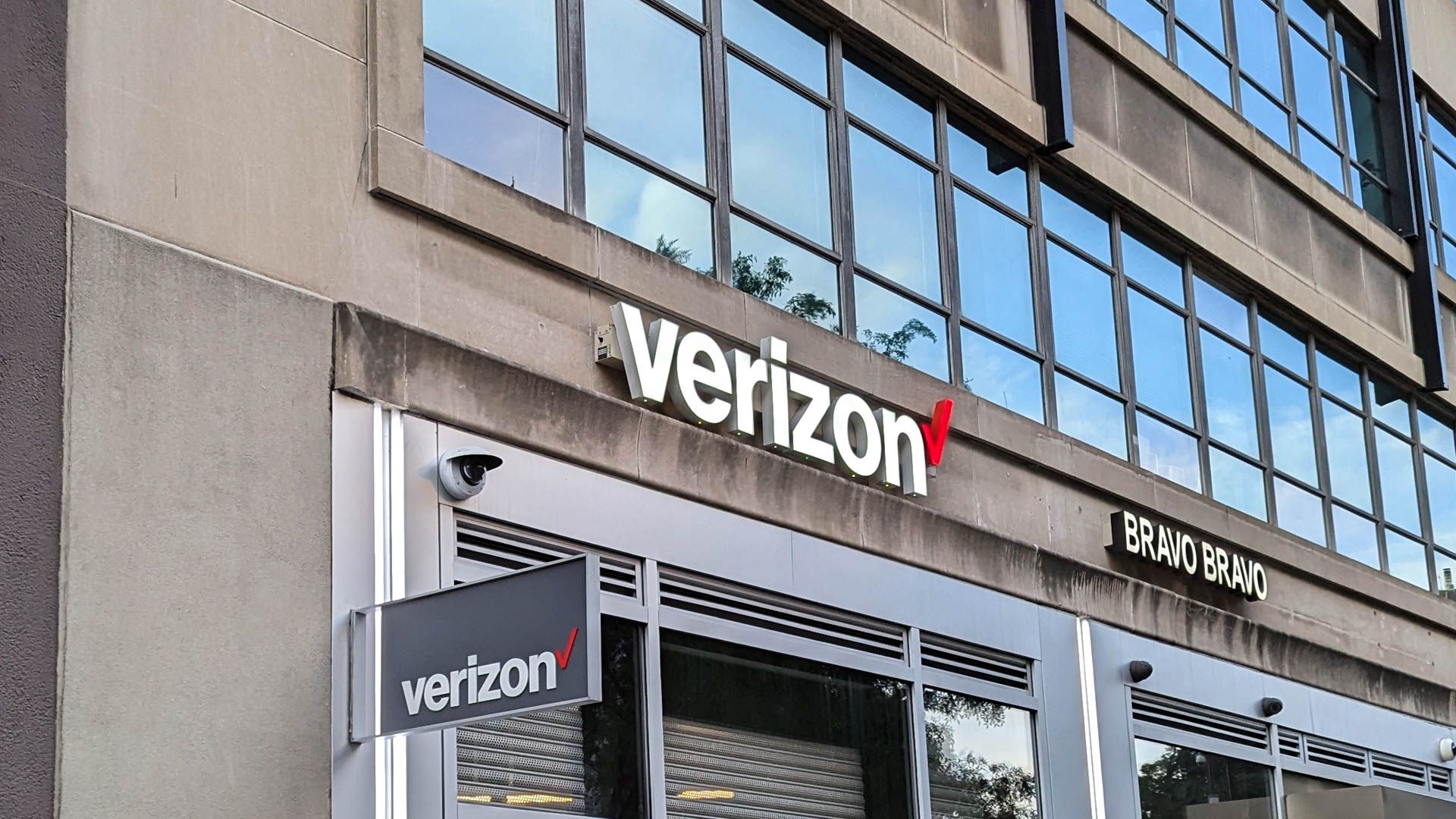 The front of a Verizon store in a city