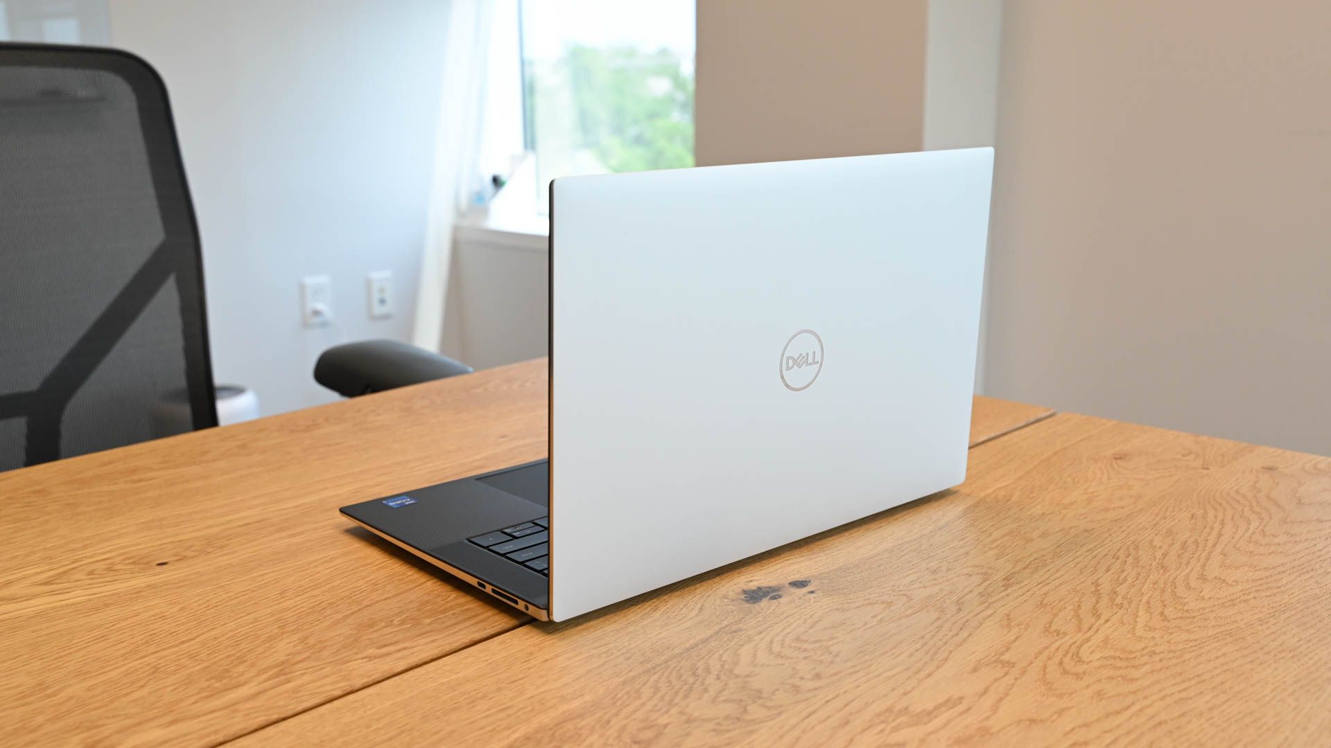 Rear view of the Dell XPS 15 (9530) laptop on a conference table.