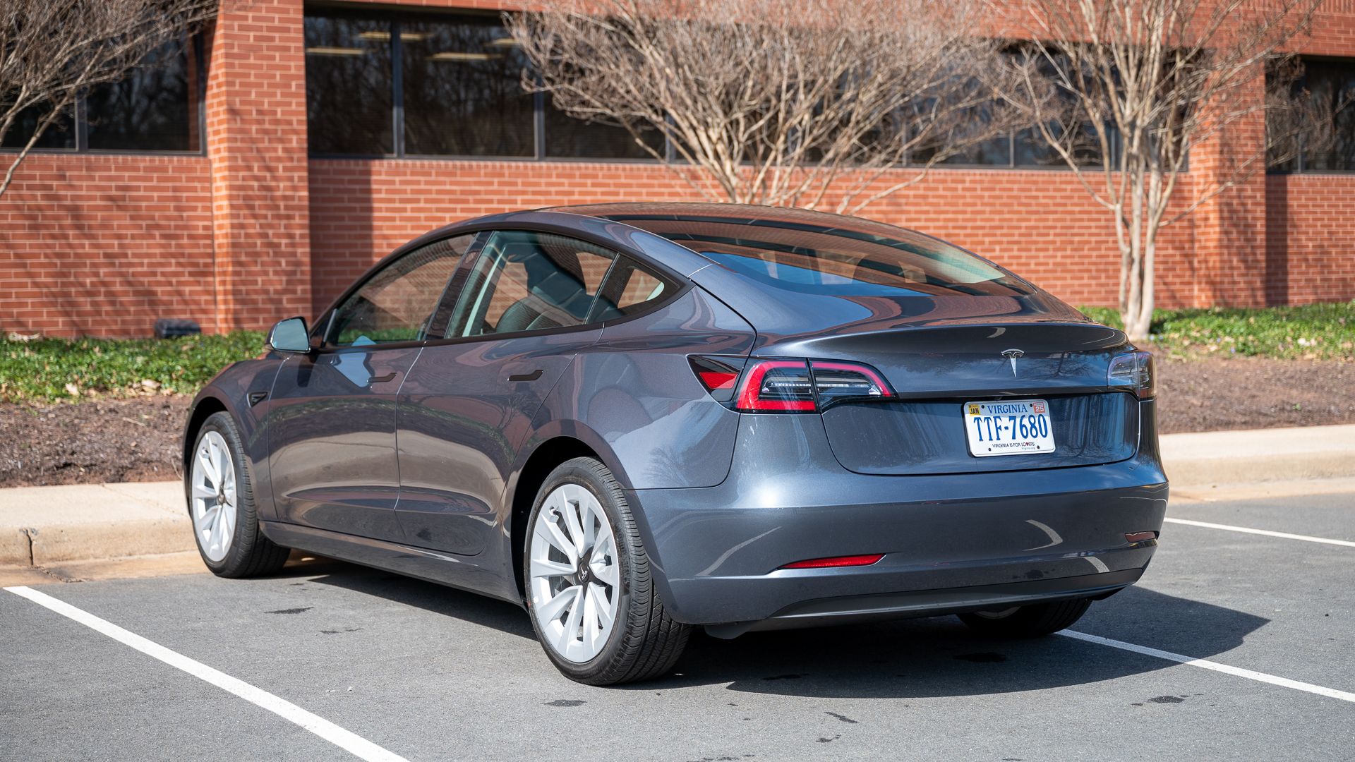 Rear and side profile of the Tesla Model 3.