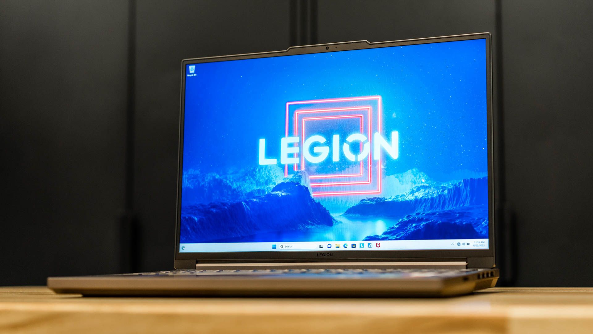 Showing the Lenovo Legion 5 Gen 8 sitting on a table with the screen open