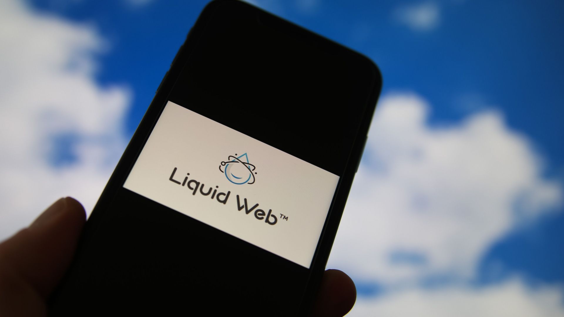 Closeup of smartphone with logo lettering of cloud computing provider service liquid web