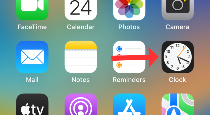 iPhone's home screen with an arrow next to the Clock app
