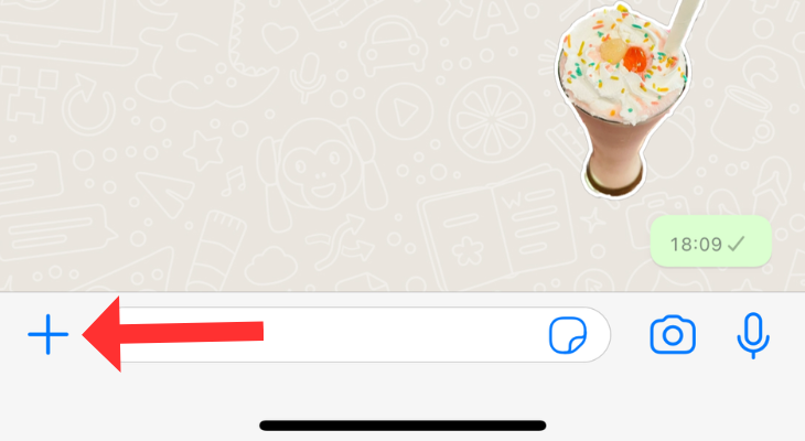 WhatsApp chatbox with an arrow highlighting the attachment icon