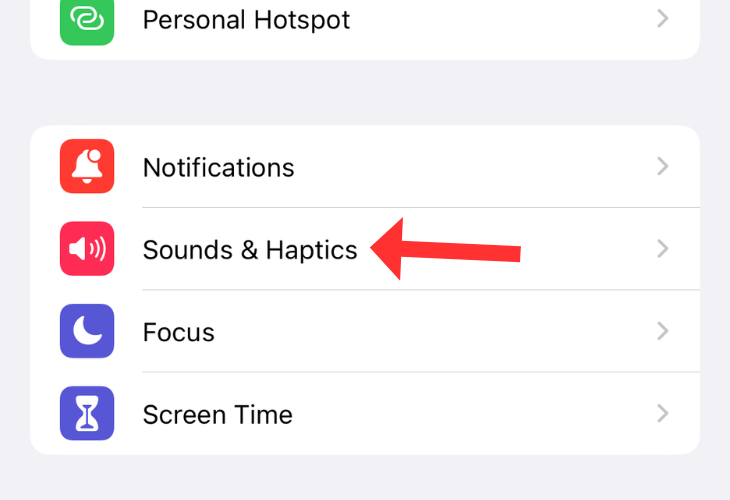 Options in Settings app on an iPhone with an arrow next to the Sound & Haptics option