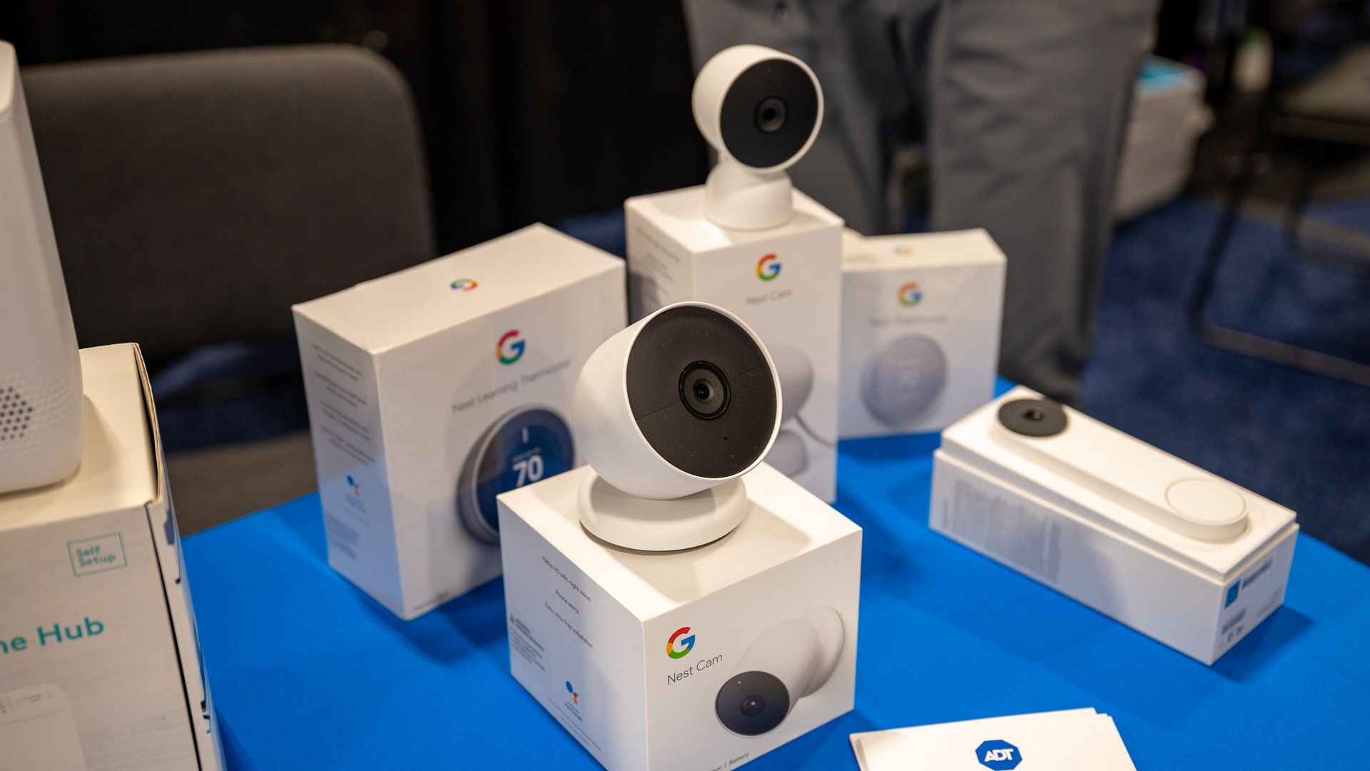Google indoor and outdoor Nest Cam, Learning Thermostat, and Hello doorbell at ADT's CES 2023 booth