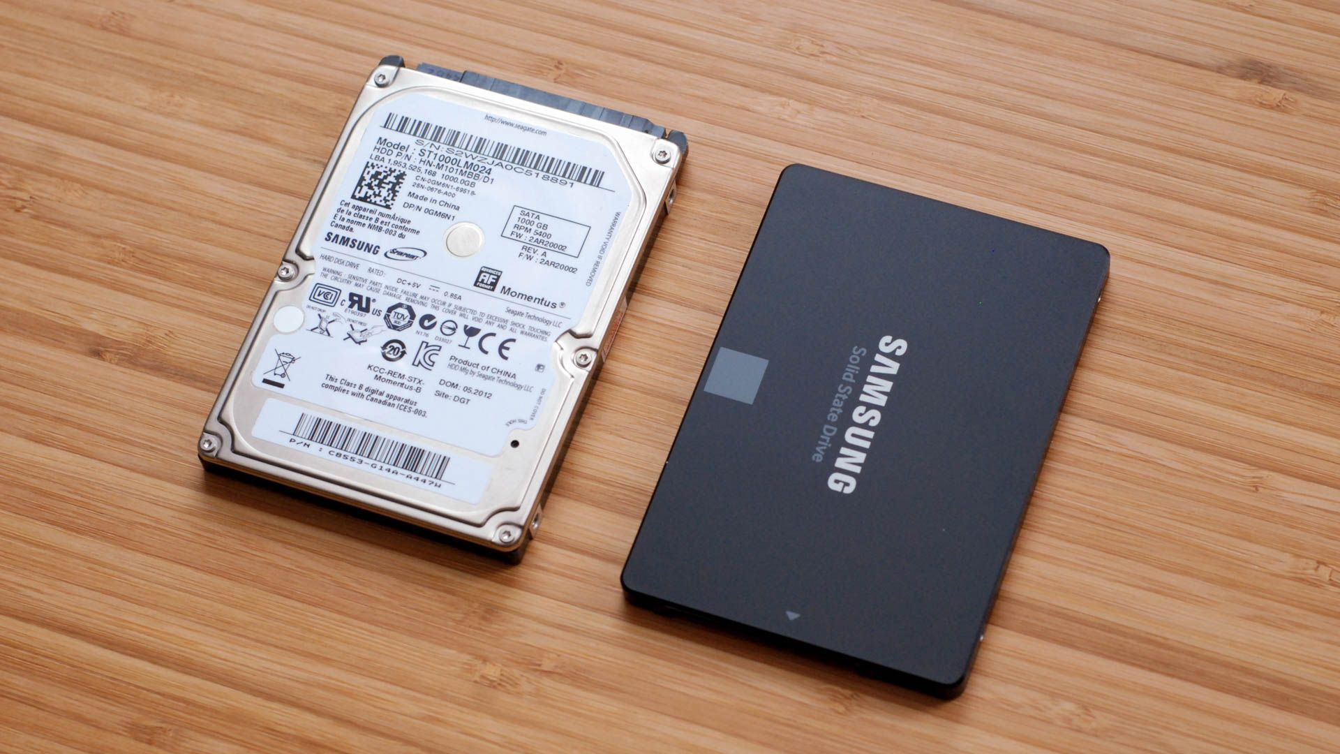 A mechanical hard drive to the left of a SATA SSD. 