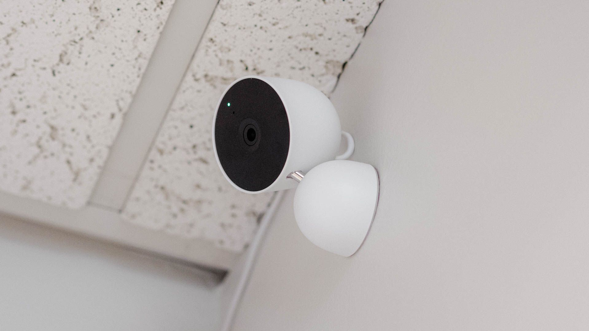 Google Nest indoor security camera mounted to a wall